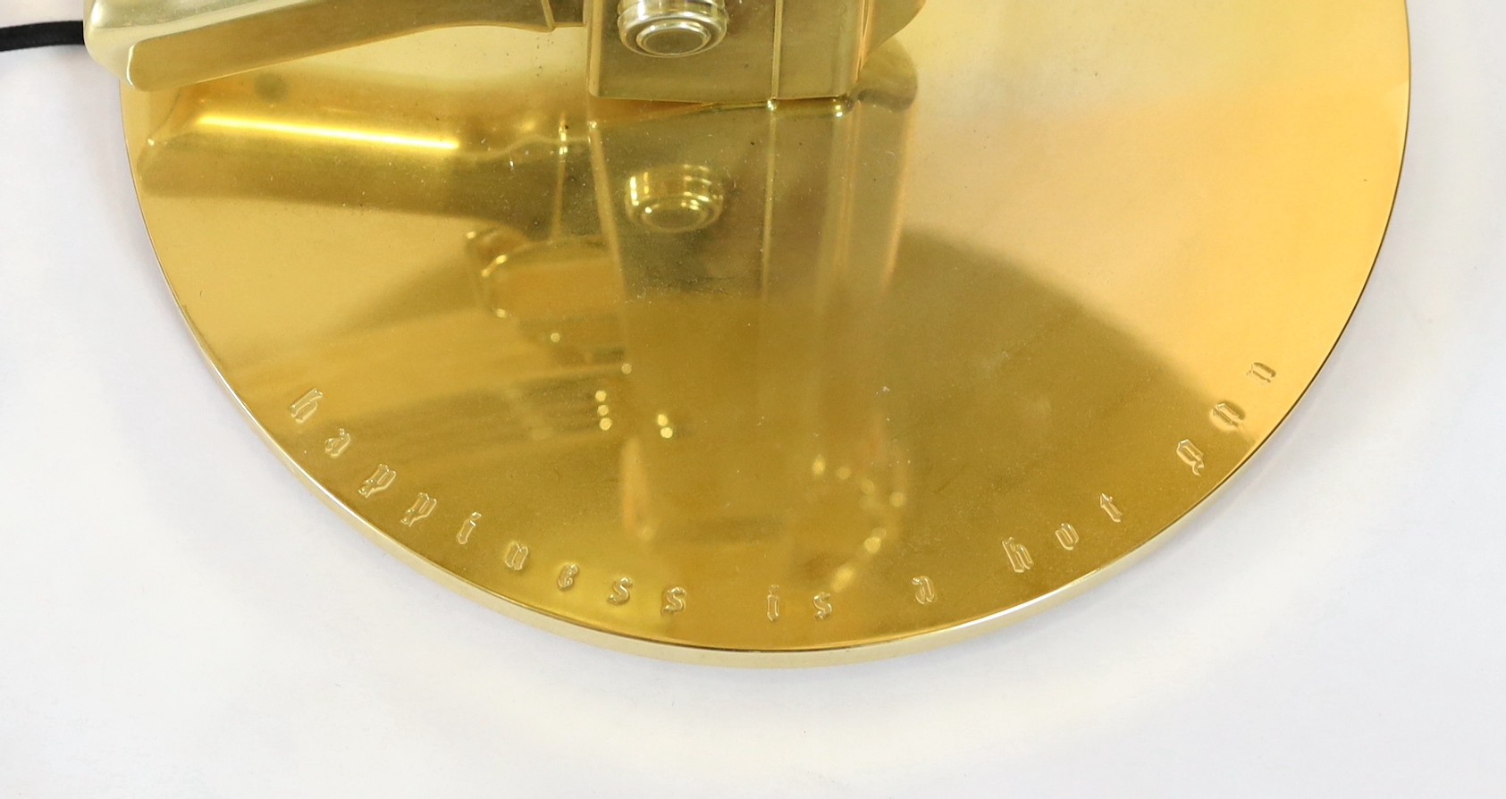 A Philippe Starck gilt metal kalashnikov table lamp, height overall 93cm